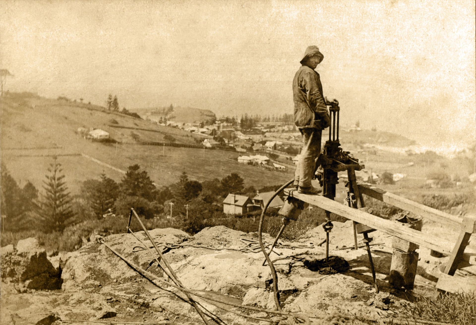 A Black And White Photo Of A Man Standing On A Bridge — Burnetts On Barney in Kiama, NSW