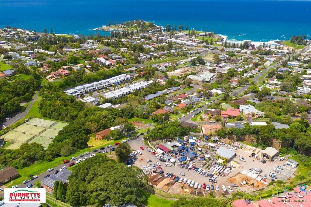 An Aerial View Of A City With A Lot Of Cars Parked In Front Of It — Burnetts On Barney in Kiama, NSW