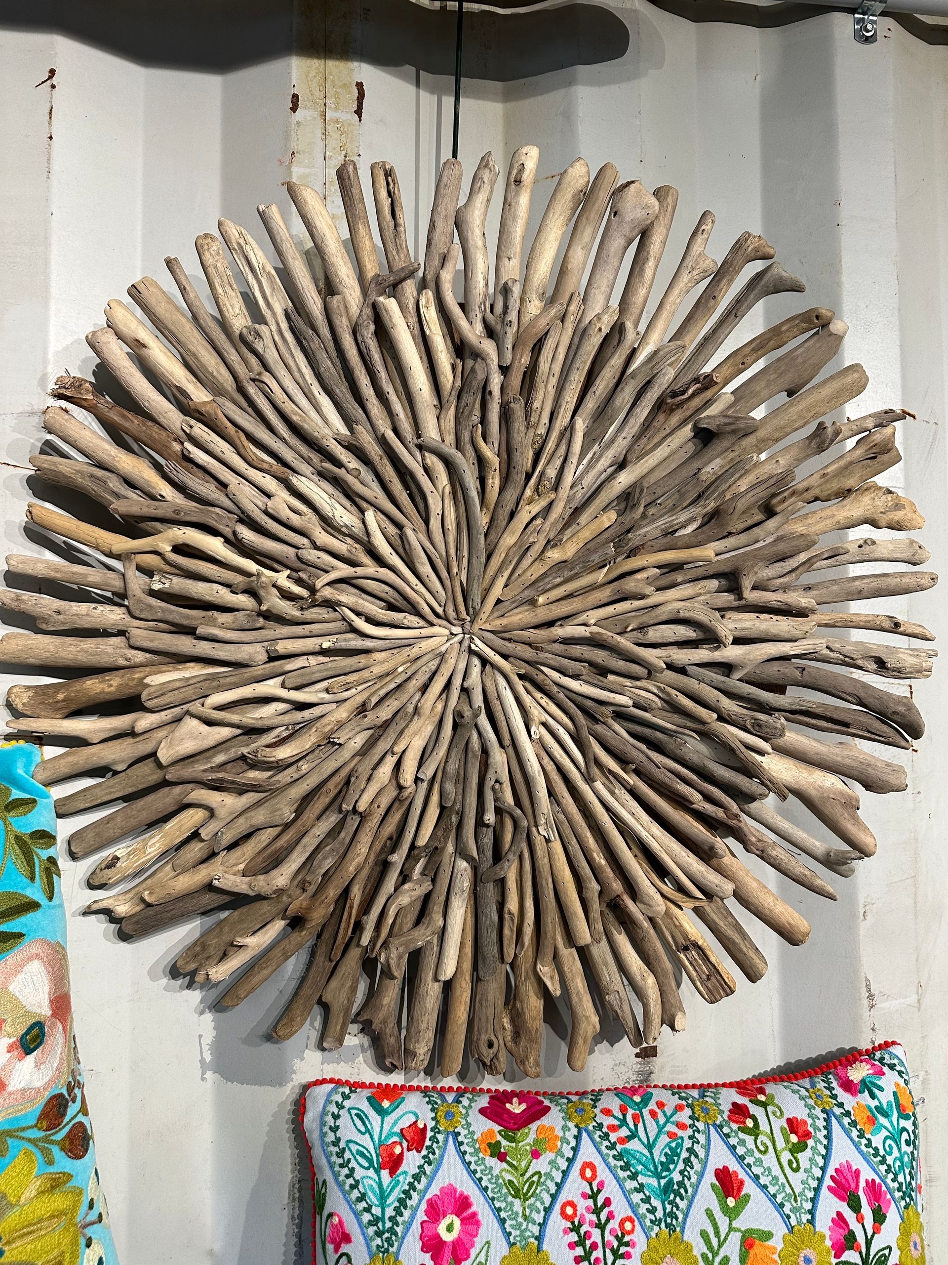 A Large Piece Of Driftwood Is Hanging On A Wall — Burnetts On Barney in Kiama, NSW