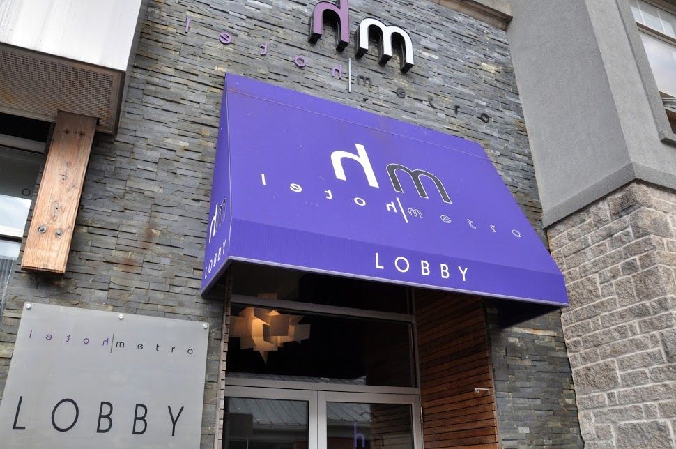 Purple awning above entrance to