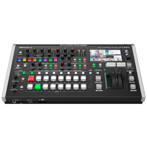 Black video switcher with buttons, faders, and a screen, on a white background.