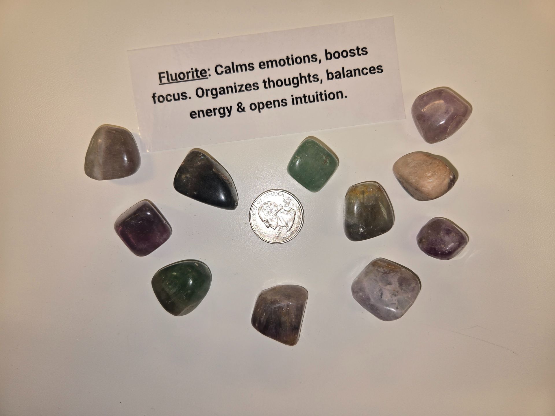 A group of crystals with a card that says