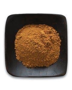 A black square bowl filled with brown powder on a white background.