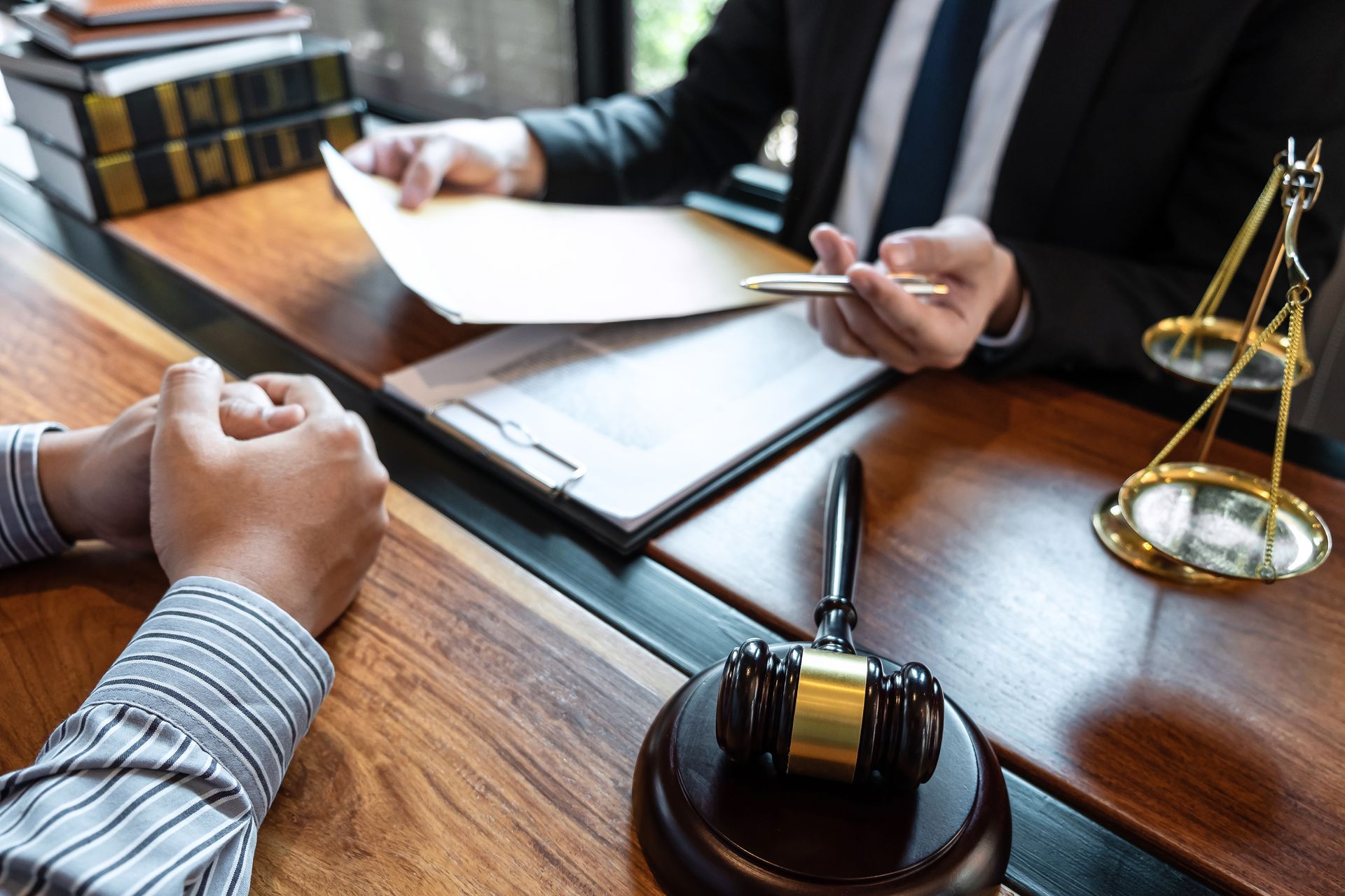 A lawyer is talking with a client. A lawyer is talking with a client.