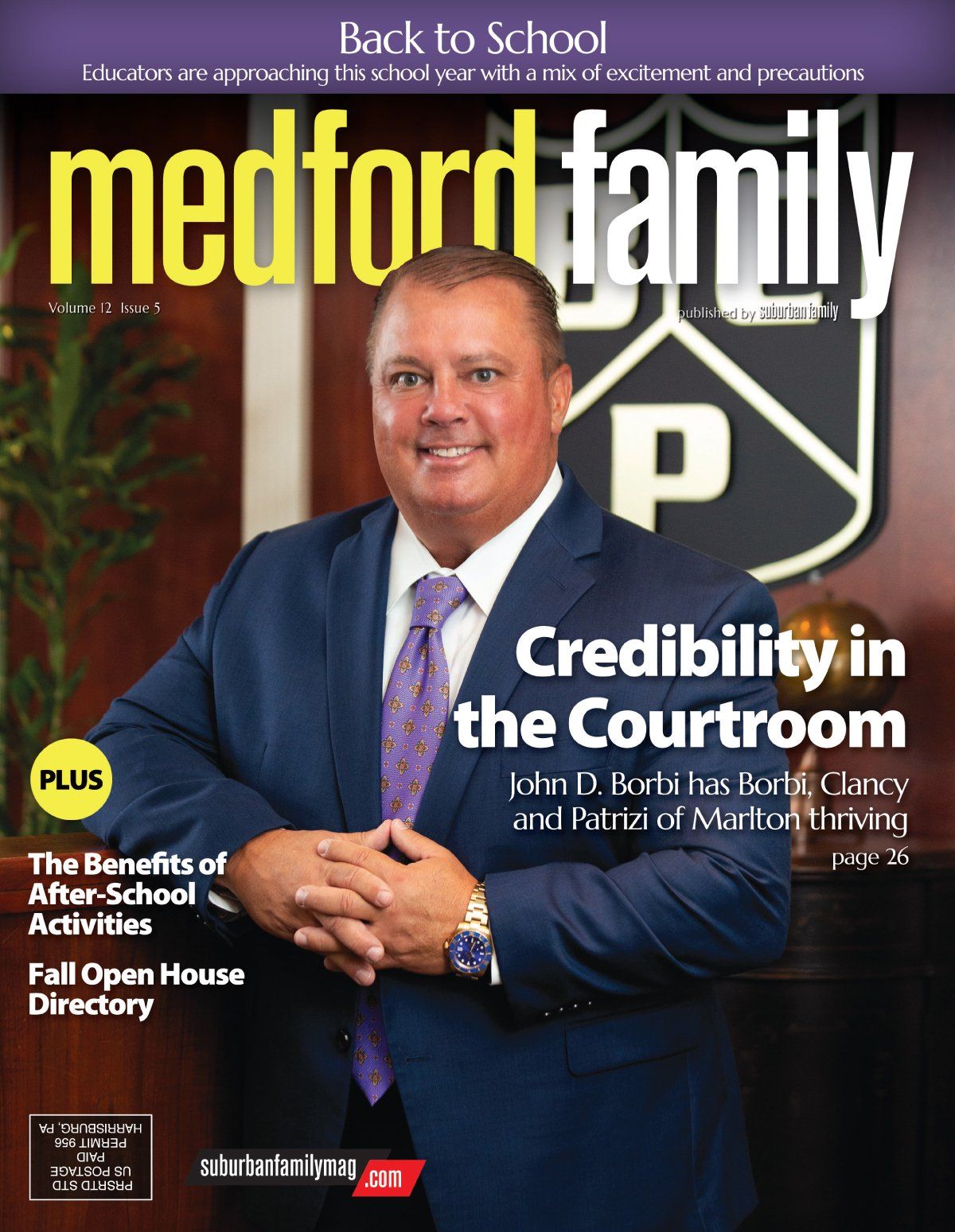 Magazine cover featuring a man in a suit, 