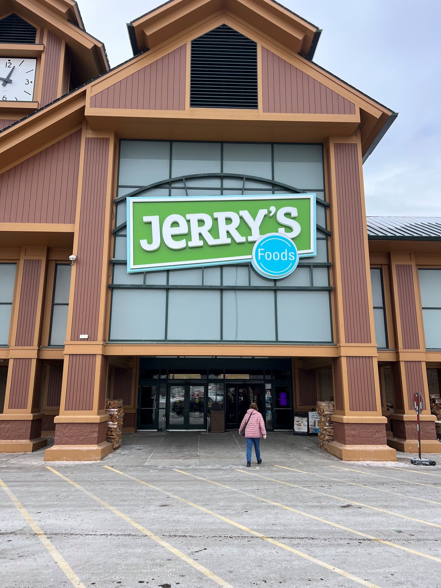 Jerry's supermarket storefront with a person walking toward the entrance