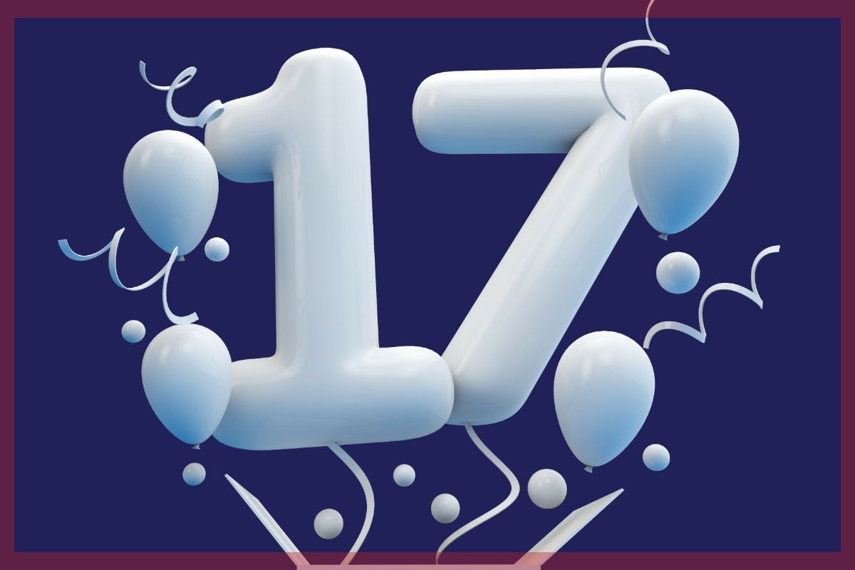 White “17” with balloons and confetti on a dark blue background
