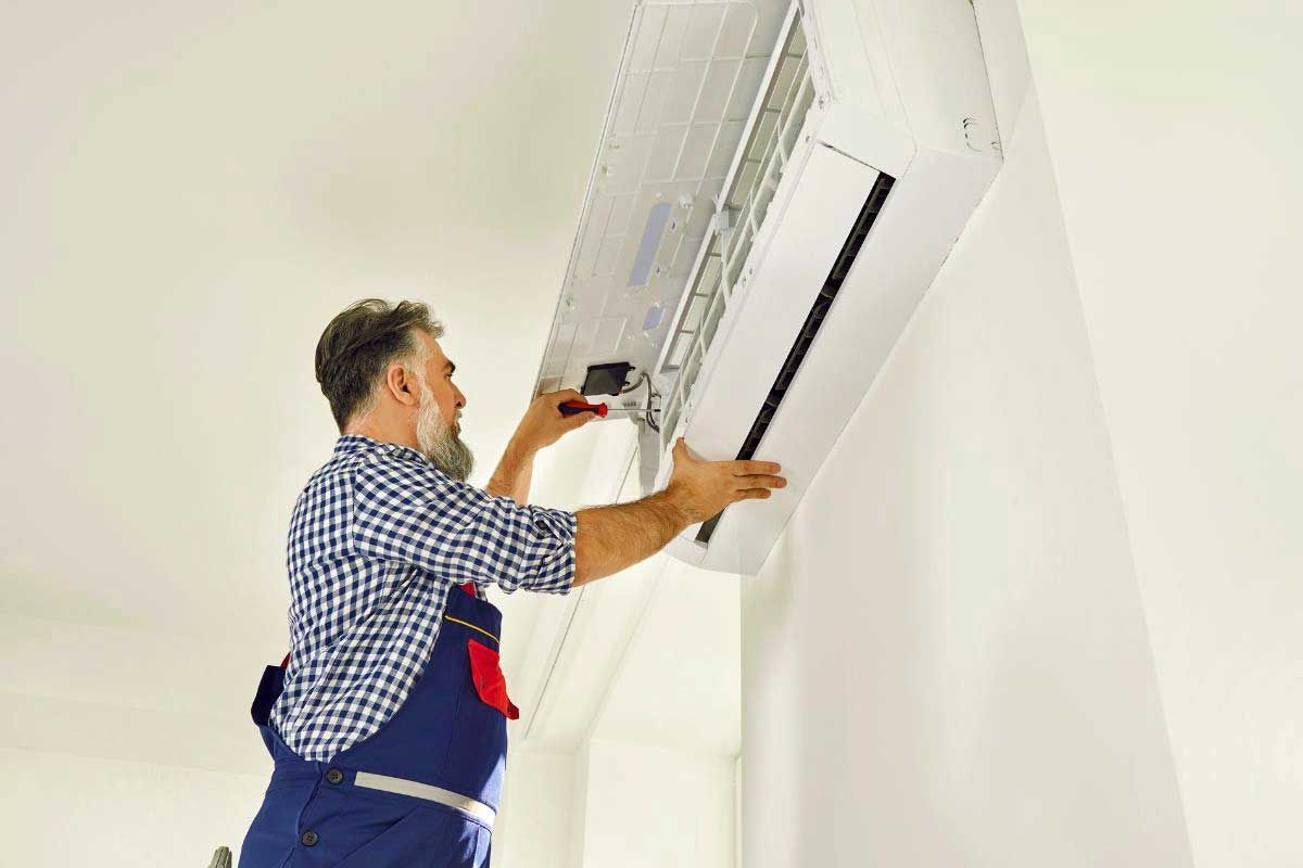 A technician doing a regular HVAC inspection.