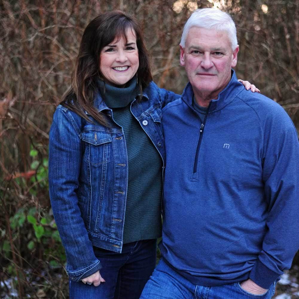 A man and a woman are posing for a picture together
