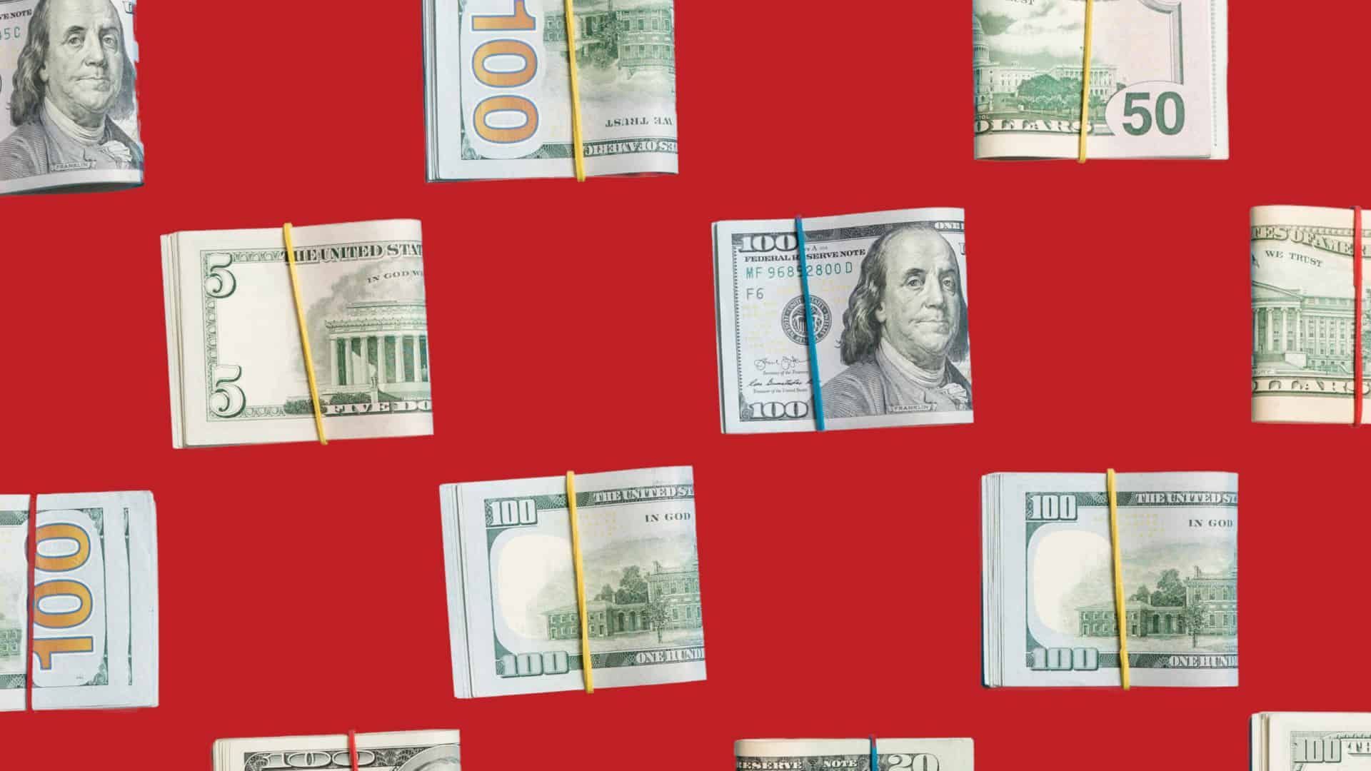 Scattered euro banknotes on a bright red background