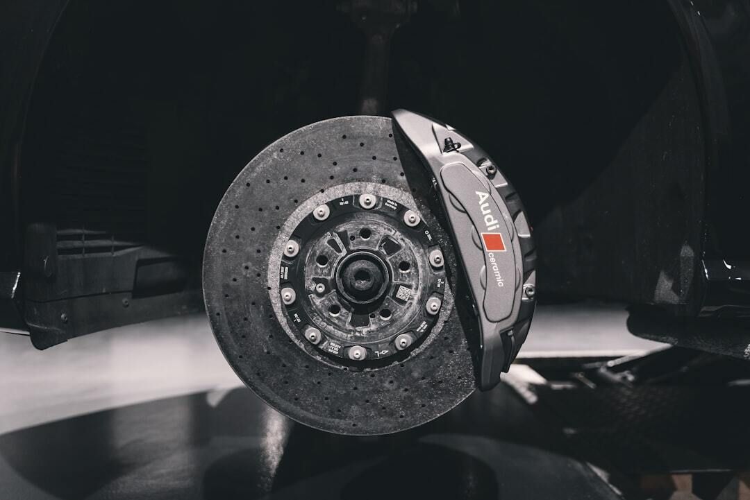 A close up of a brake disc on a car.