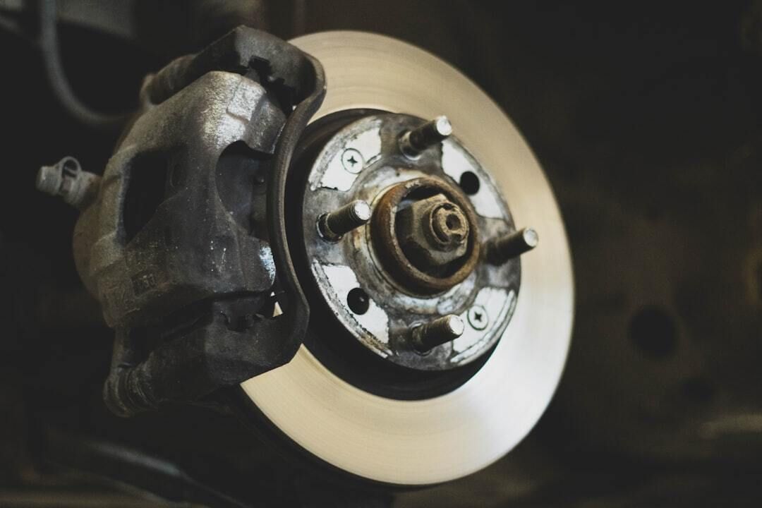 A close up of a brake disc on a car.