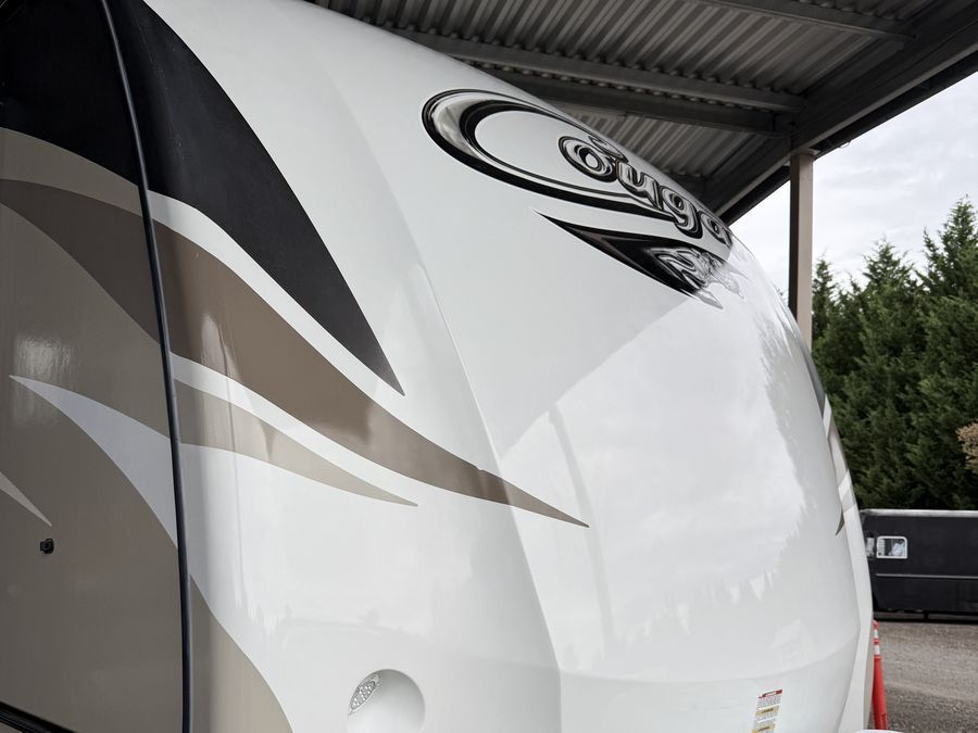 Glossy travel trailer front cap after EcoRV Pro 5-year protective coating was applied