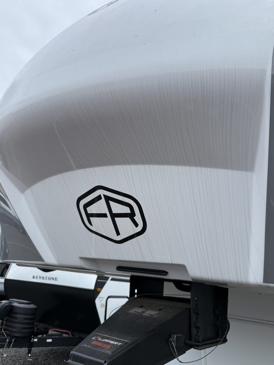Fifth wheel front cap with black streaks running down the fiberglass before cleaning in Newberg, Oregon