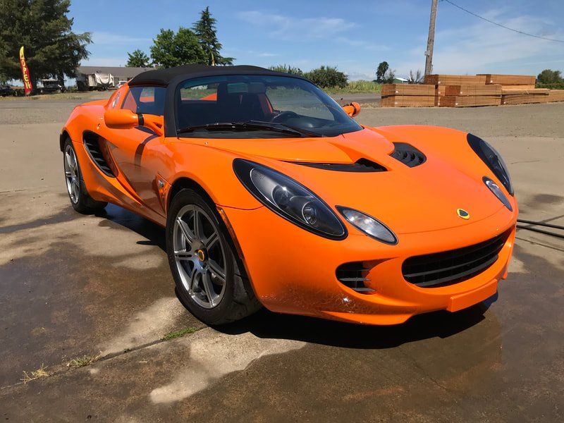 Orange Lotus in Monmouth oregon getting detailed by keptcar
