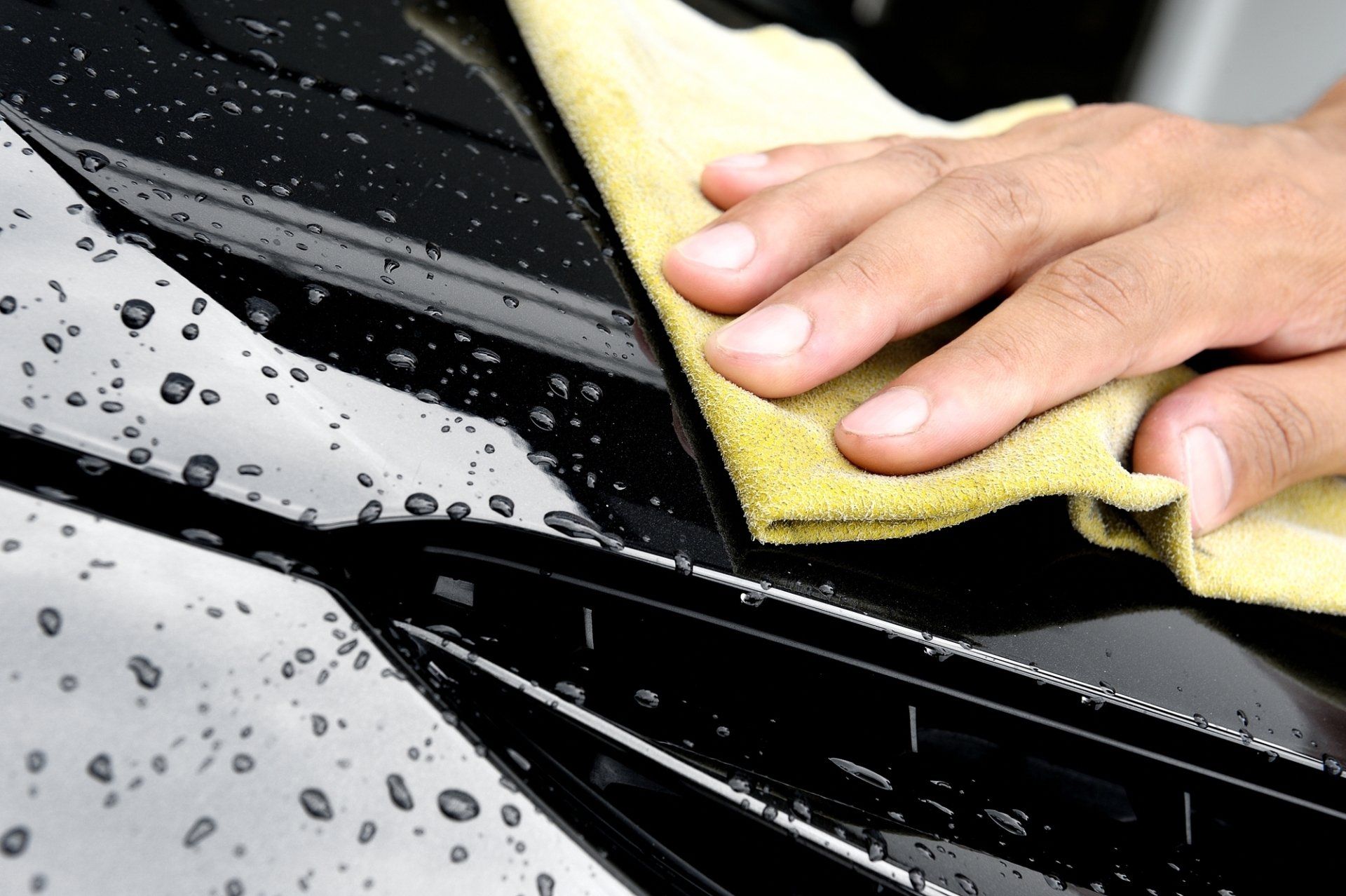 Applying long-lasting ceramic coating on a car by Keptcar in Portland, Oregon