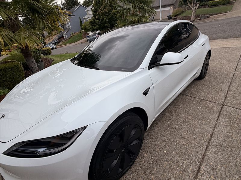 Same Tesla Model 3 with dark tinted windows after KeptCar window tint