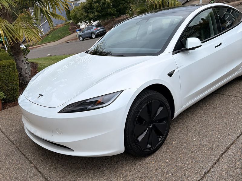 White Tesla Model 3 with clear factory windows before tint