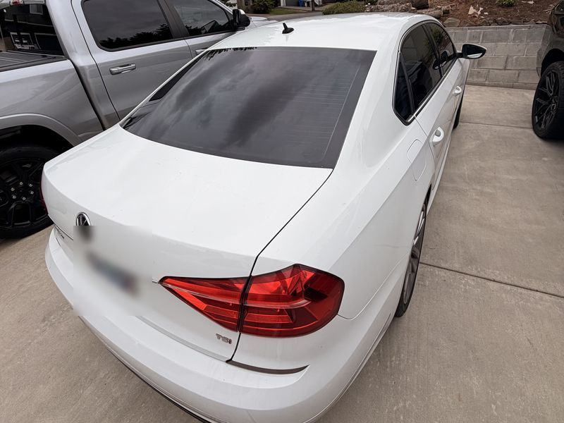 Volkswagen Passat rear window with smooth new tint after replacement
