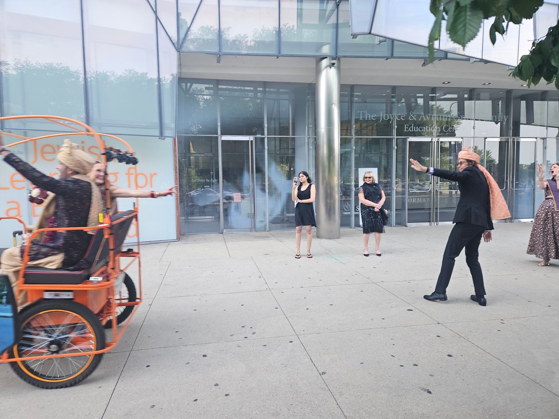 Our bike taxi chicago service is perfect for special events, like this festive wedding entrance featuring a custom chicago rikshaw ride with smoke effects.