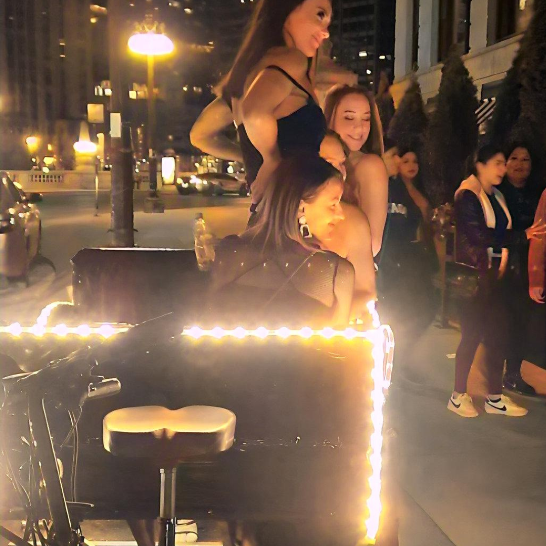 Our lighted bike taxi chicago is perfect for a night out, as shown by this group of friends enjoying their pedicab city tour.