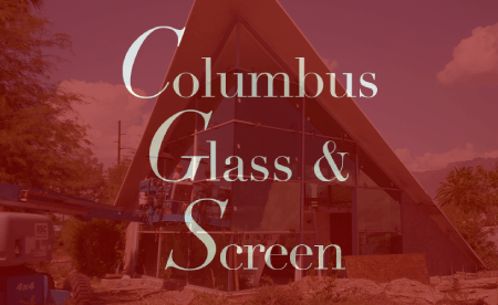 Columbus Glass & Screen text overlay on a glass building with construction equipment.