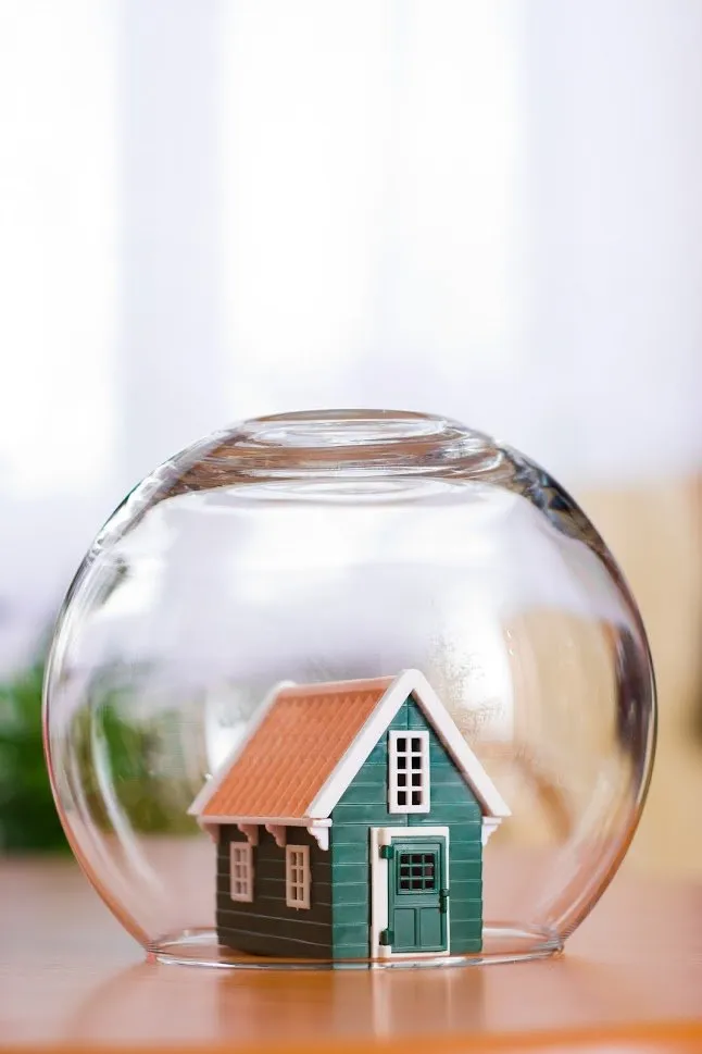 House Miniature In The Transparent Bowl | Omaha, NE | Accredited Insurance Group