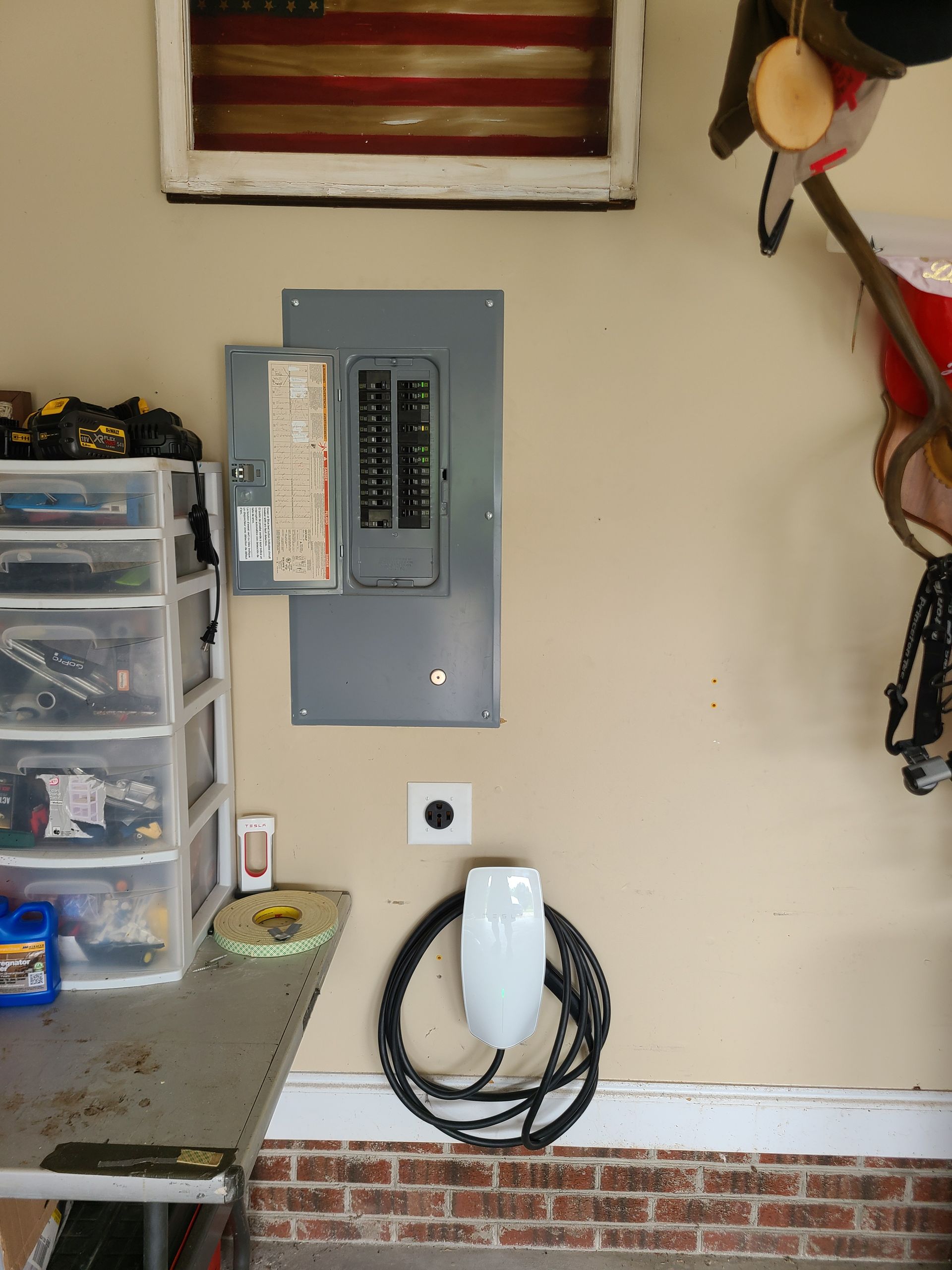 A garage with a electrical box on the wall