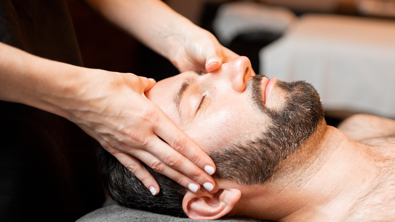 a man is getting a head massage at a spa .