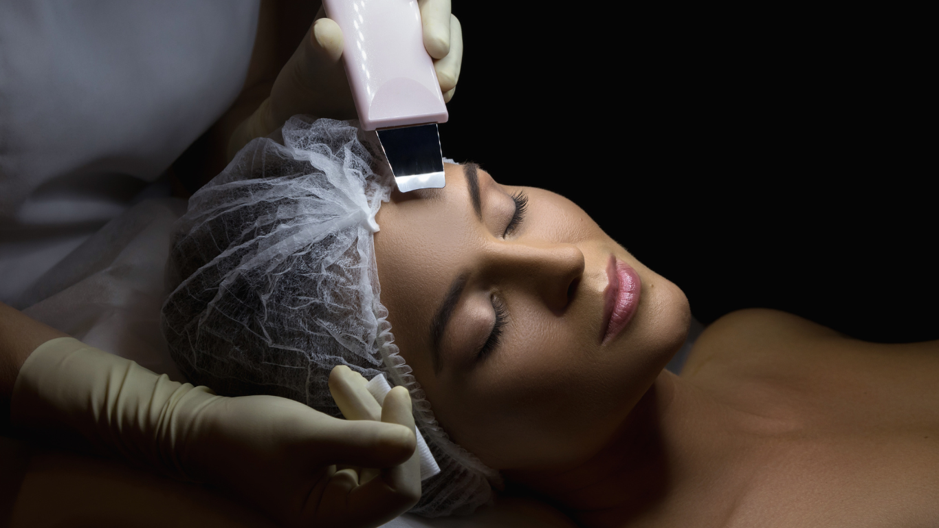 a woman is getting a facial treatment at a beauty salon .