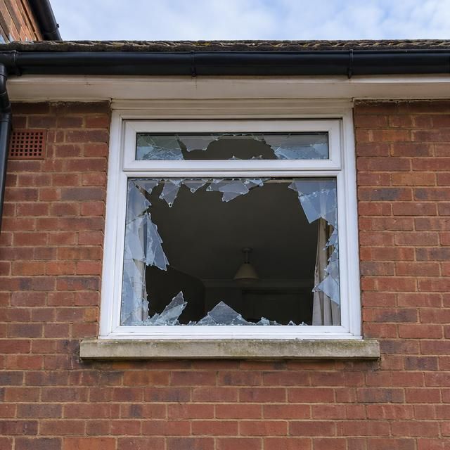 Upstairs window with smashed glass