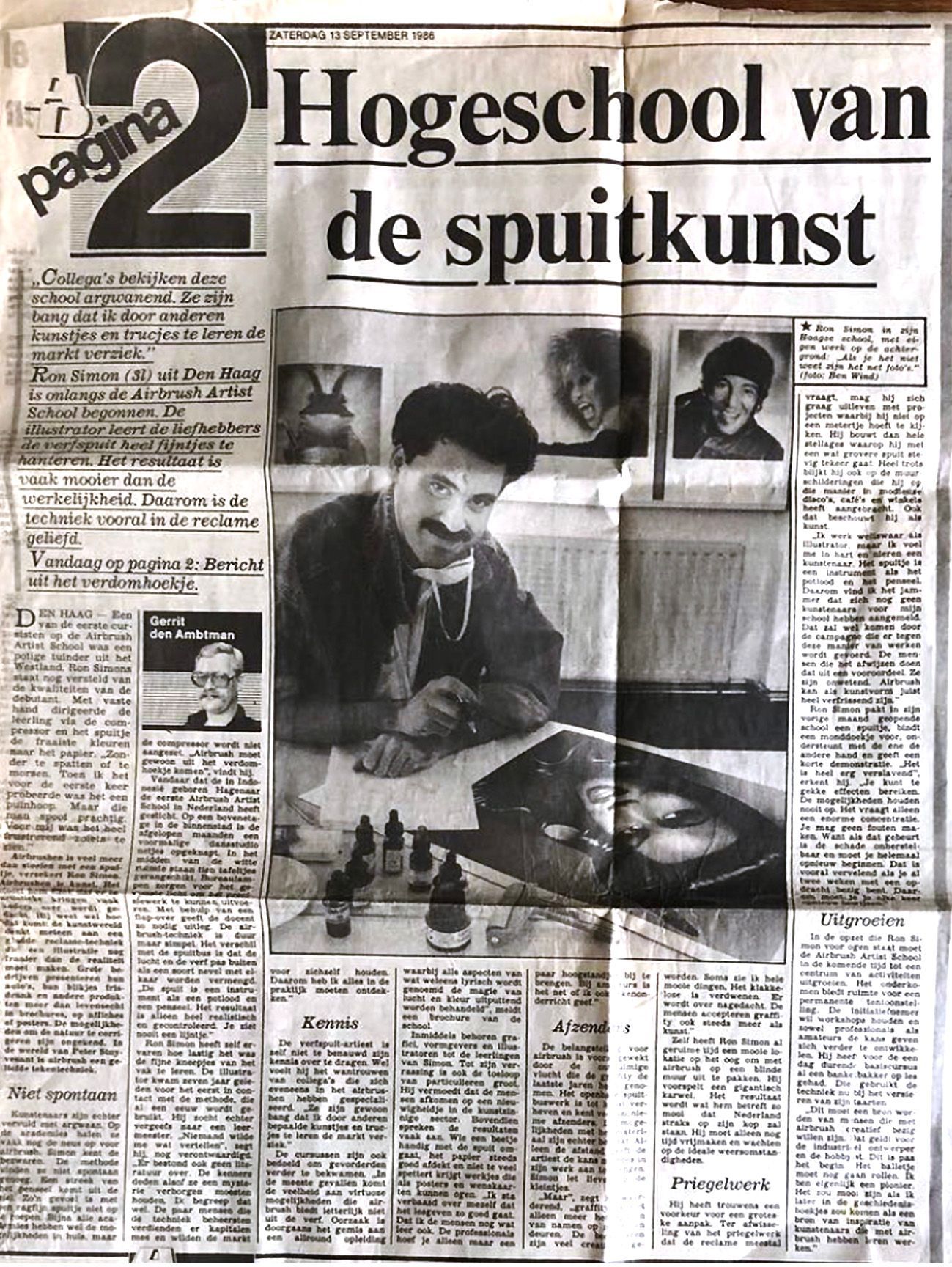 Newspaper front page with headline “Hogeschool van de spuitkunst” and photos of a man painting