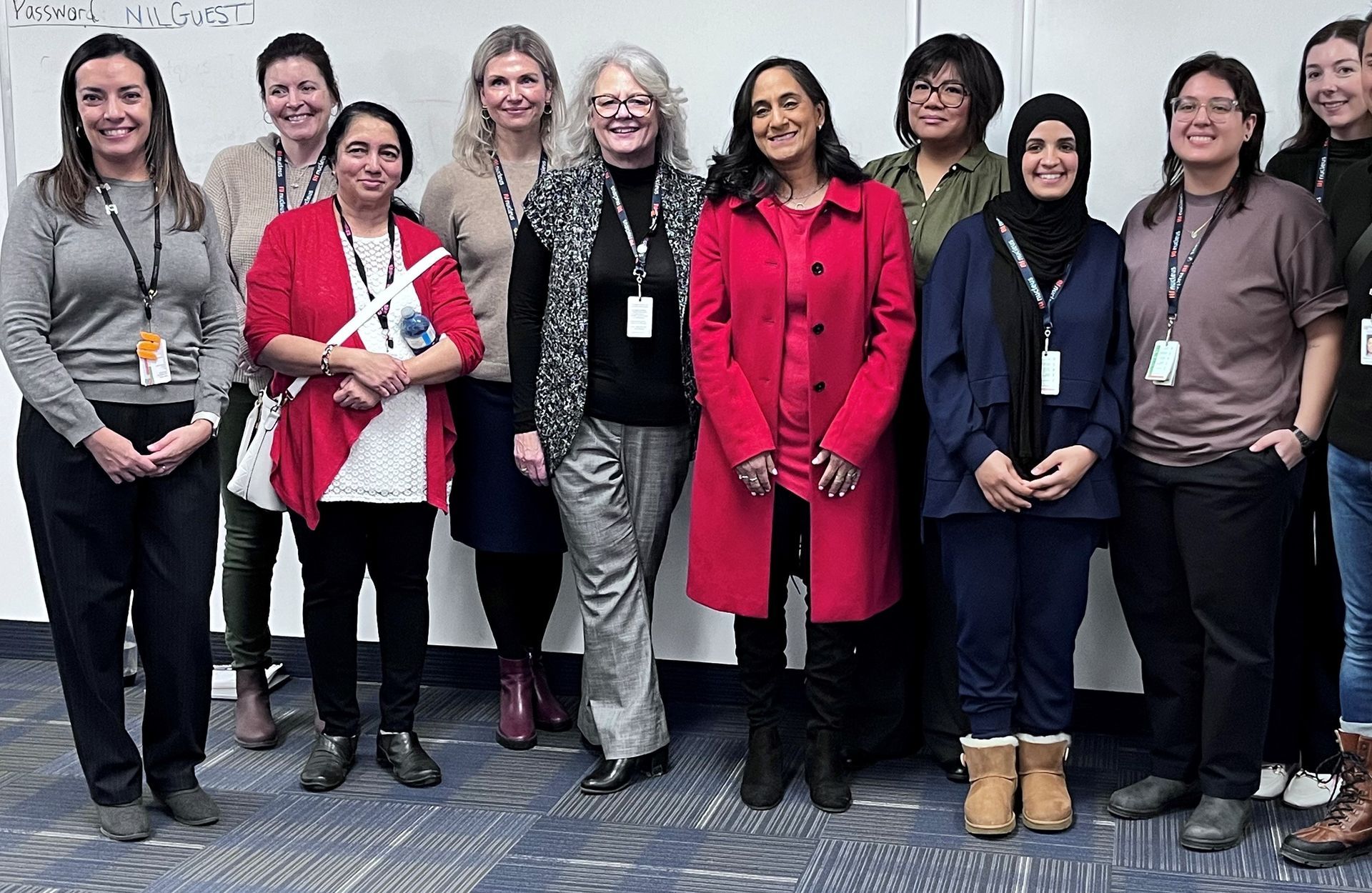 A group of women are posing for a picture together.