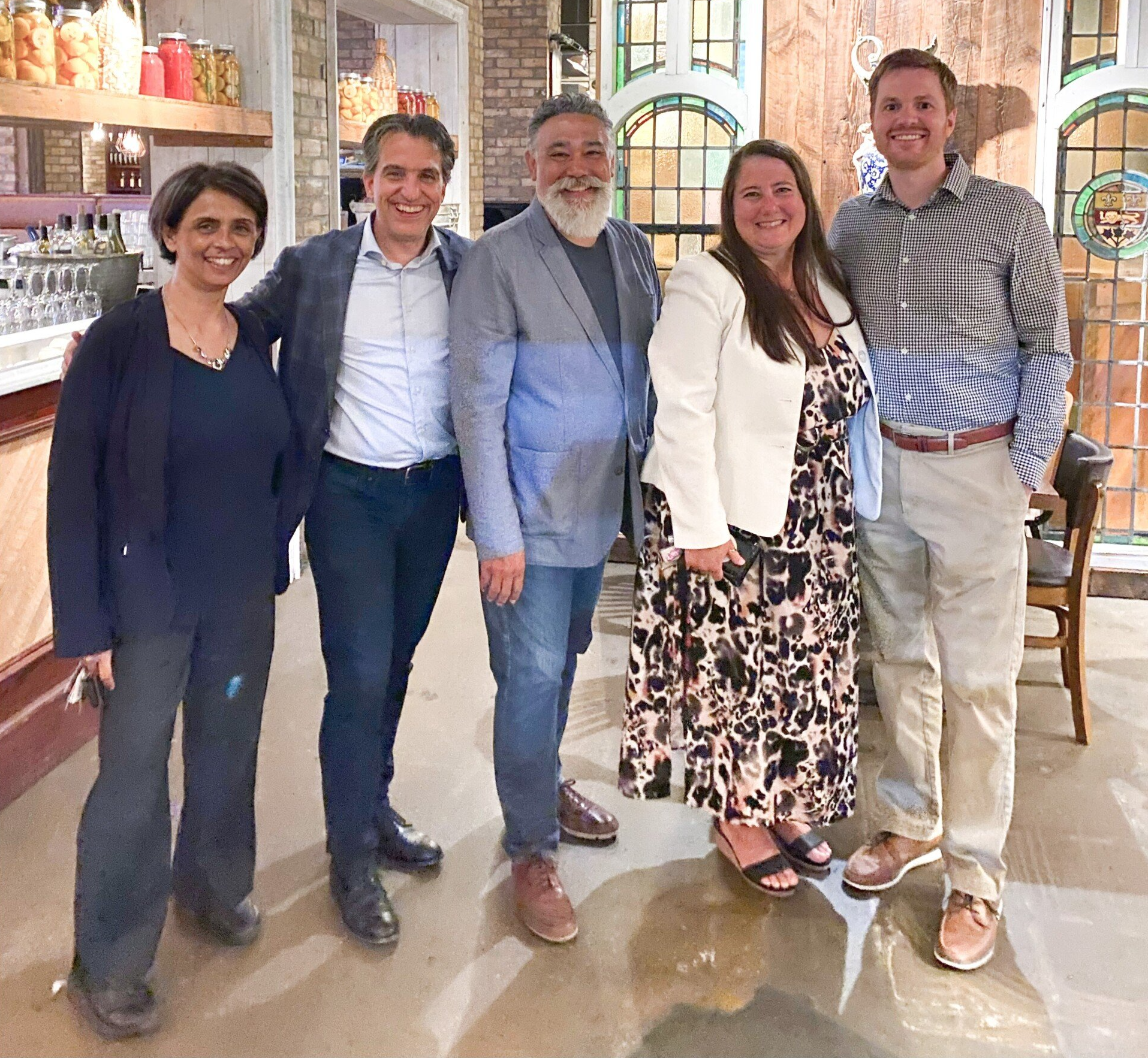 A group of people posing for a picture in a restaurant