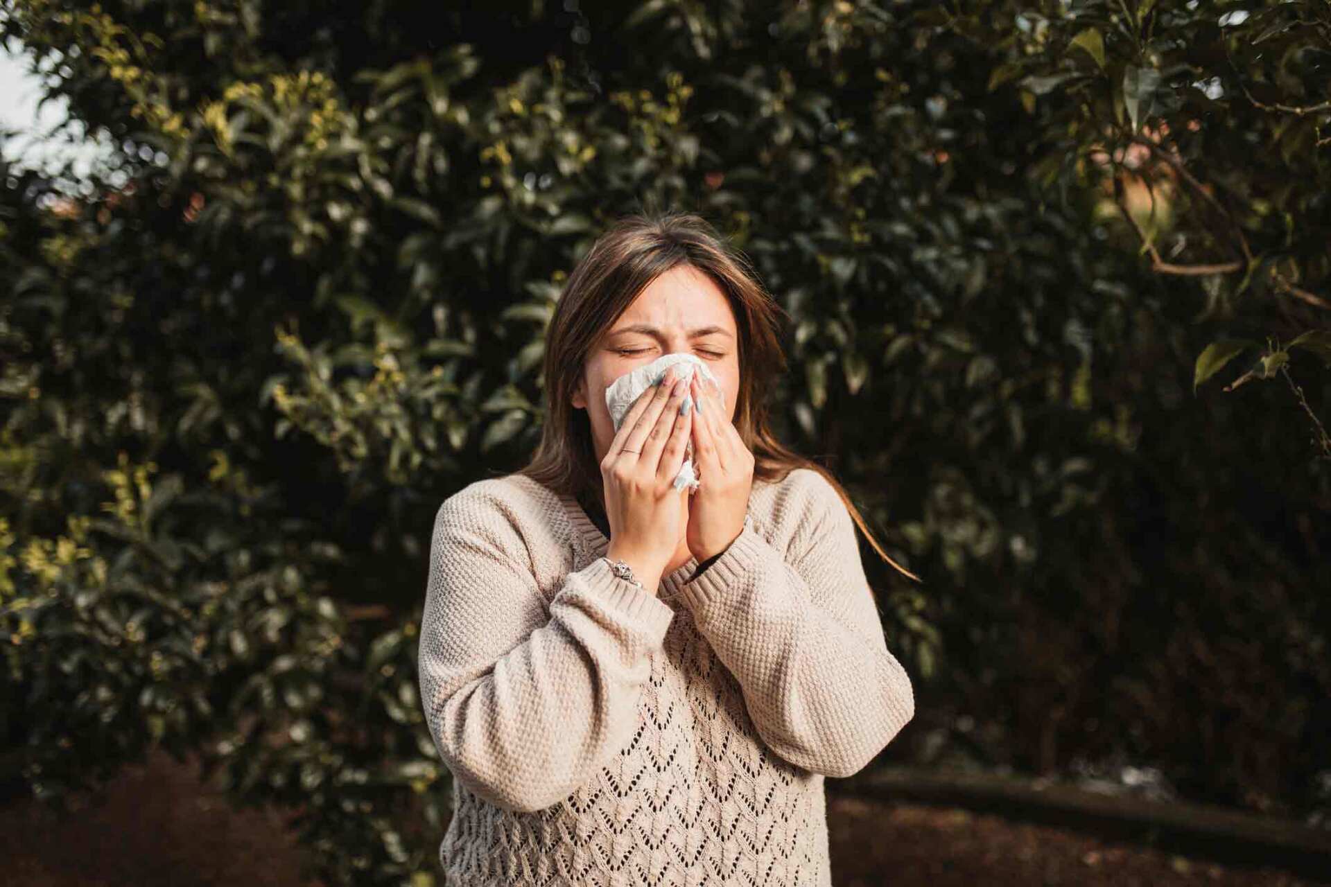 Woman Sneezing — Lexington, KY — Allergy Asthma & Immunology: Dr. Iraklis Livas