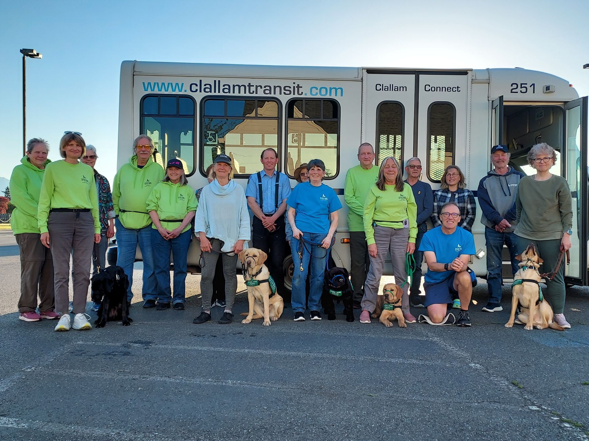 Clallam Connect bus with guide dogs and people