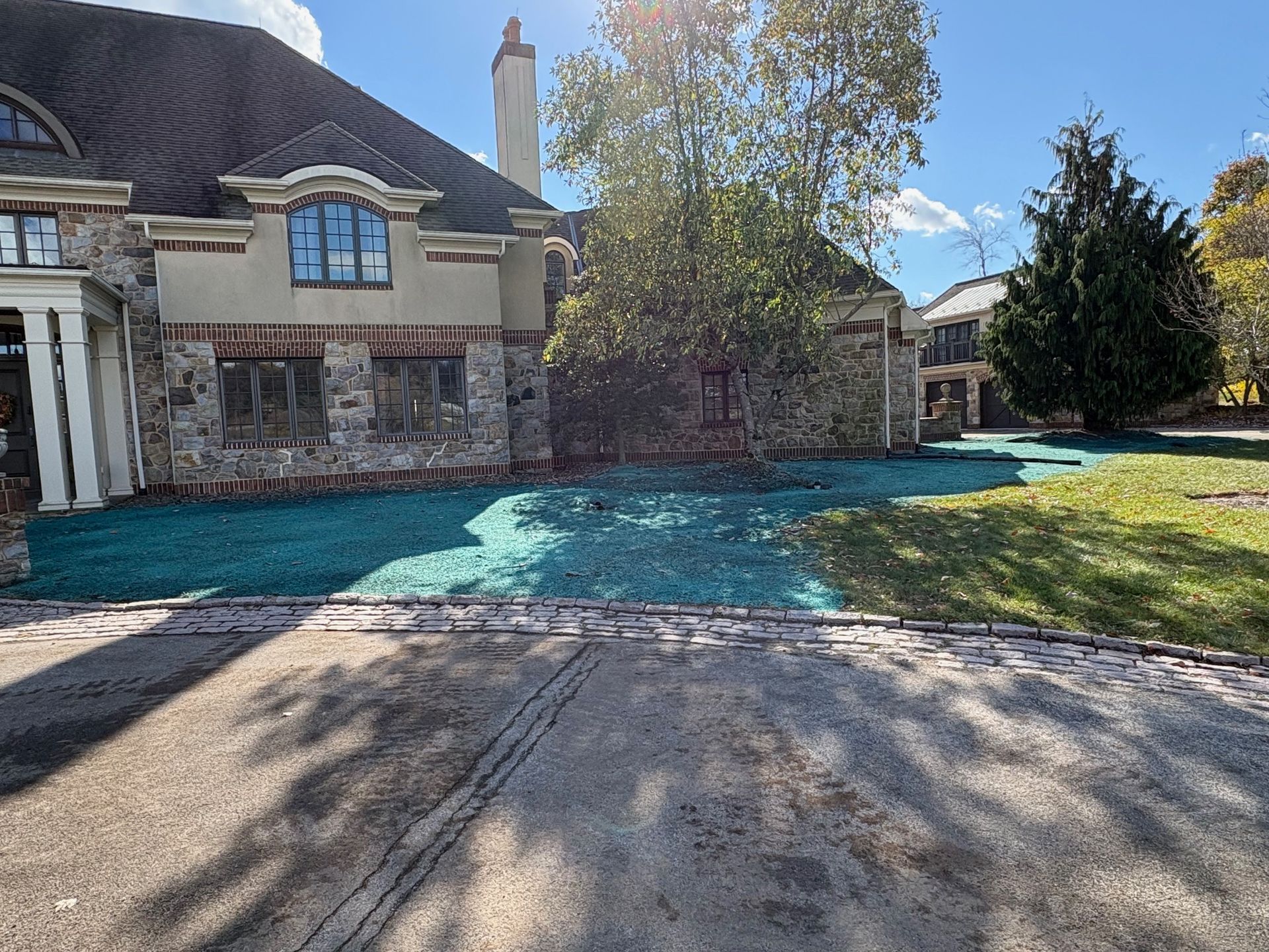 A large house with a lot of grass in front of it.