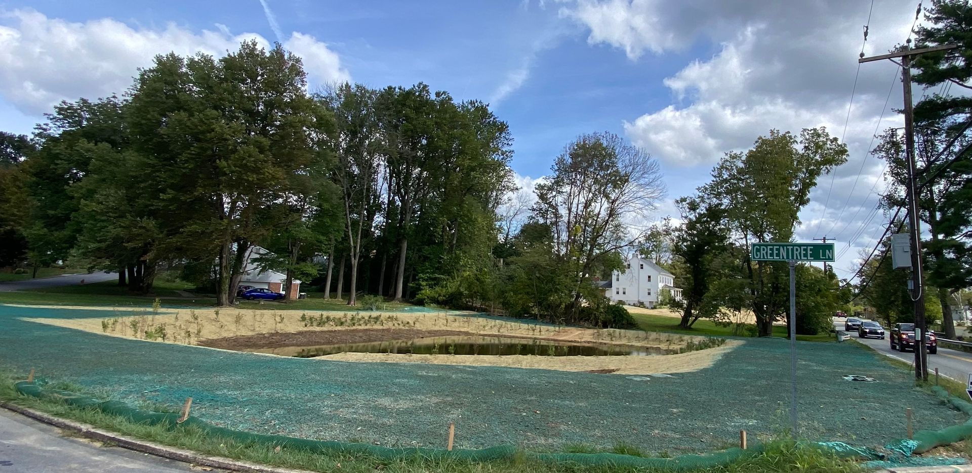 There is a lot of grass and trees in the background hydroseeding by complete property solutions of Lancaster PA