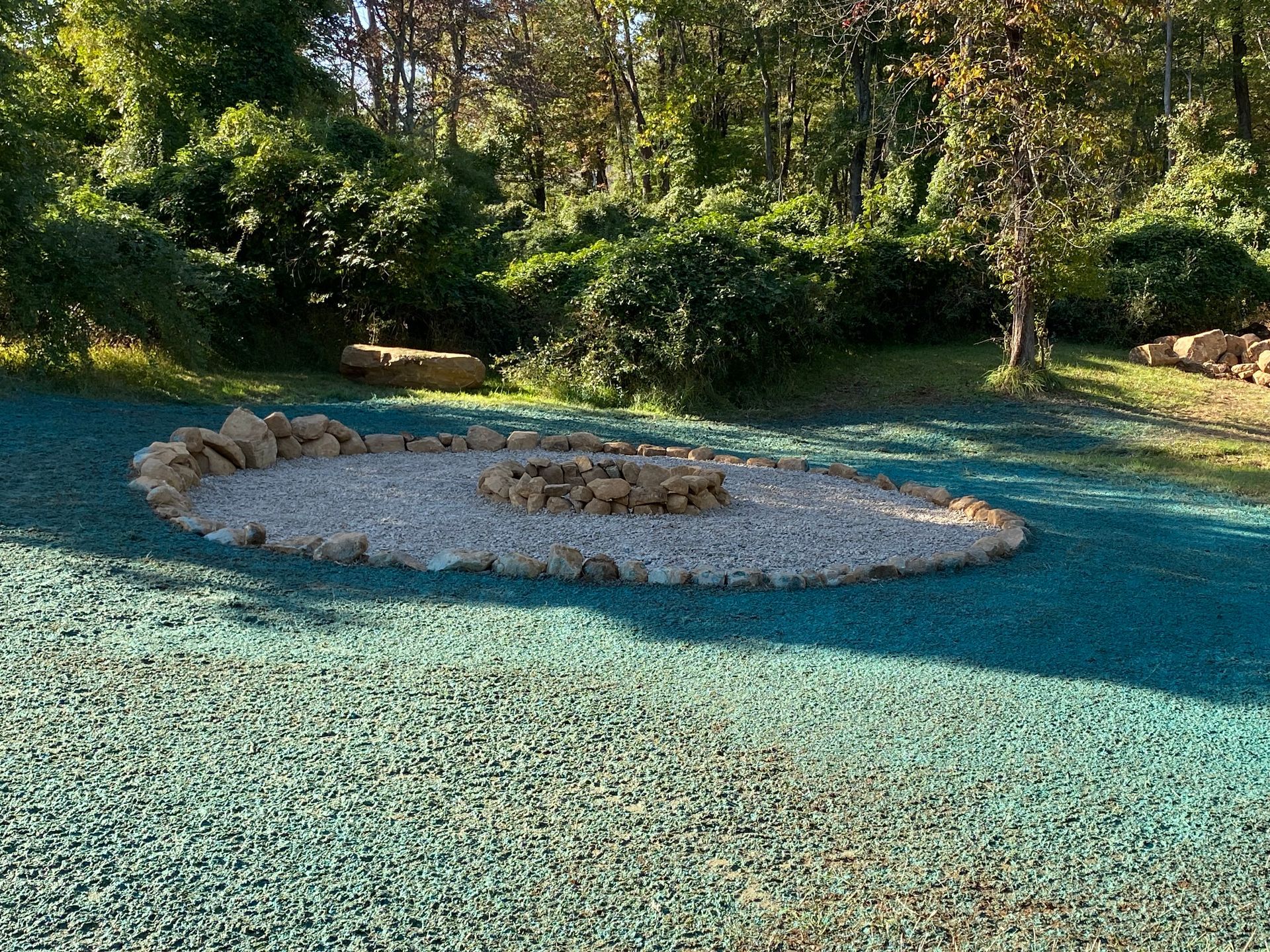 A fire pit, grading, and hydroseeding installed by complete property solutions of Lancaster PA