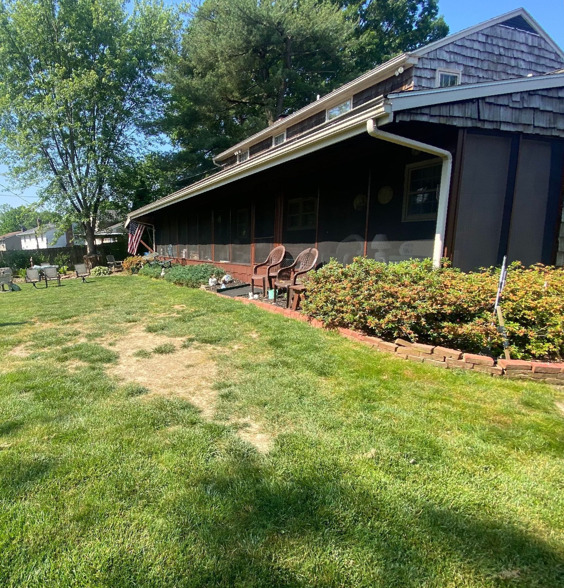 A large house with a large lawn in front of it.
