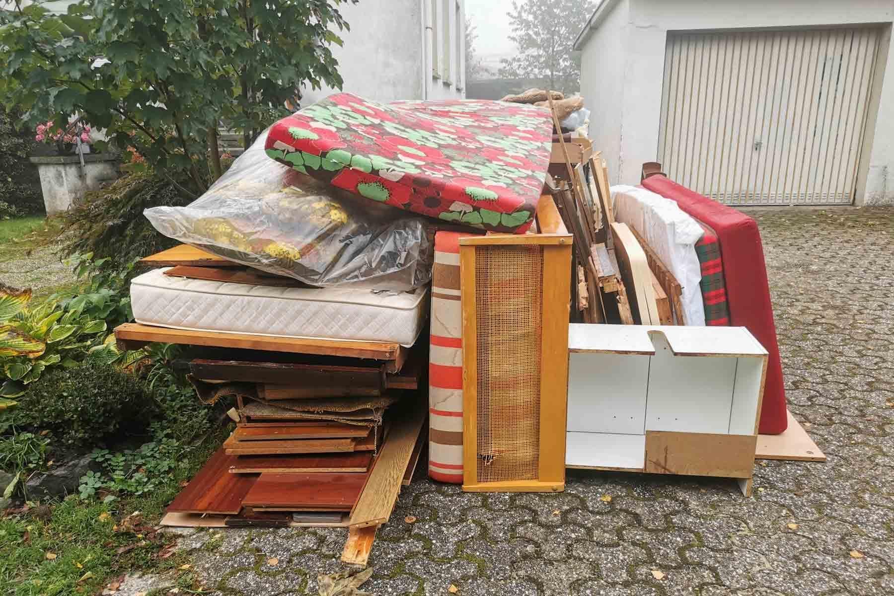 Household waste and clutter prepared for disposal during a home clean-up