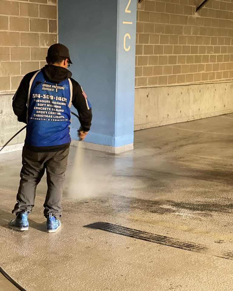 Pressure washing siding of house