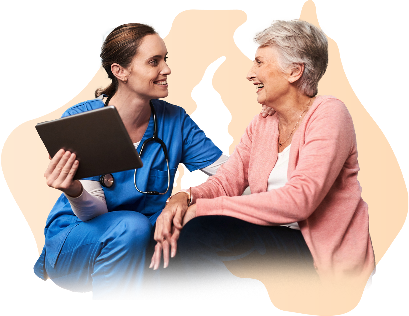 Nurse in blue scrubs with tablet, smiling at an older patient. Australian map outline in background.
