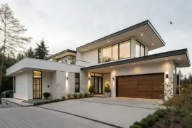 Modern white house exterior with black front door, windows, and landscaped walkway