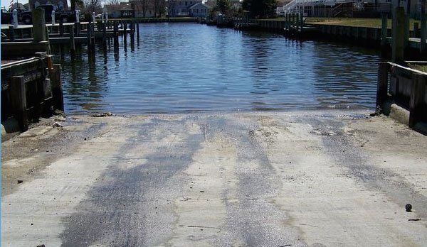 A concrete ramp leading into a body of water
