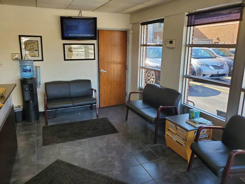 Comfortable Waiting Area With Seating And TV At Auto Repair Shop | J. Benak Service Inc.