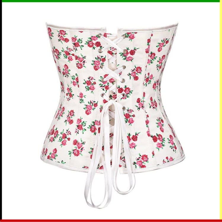 Witte corset met bloemenprint, versierd met roze rozen en groene bladeren.