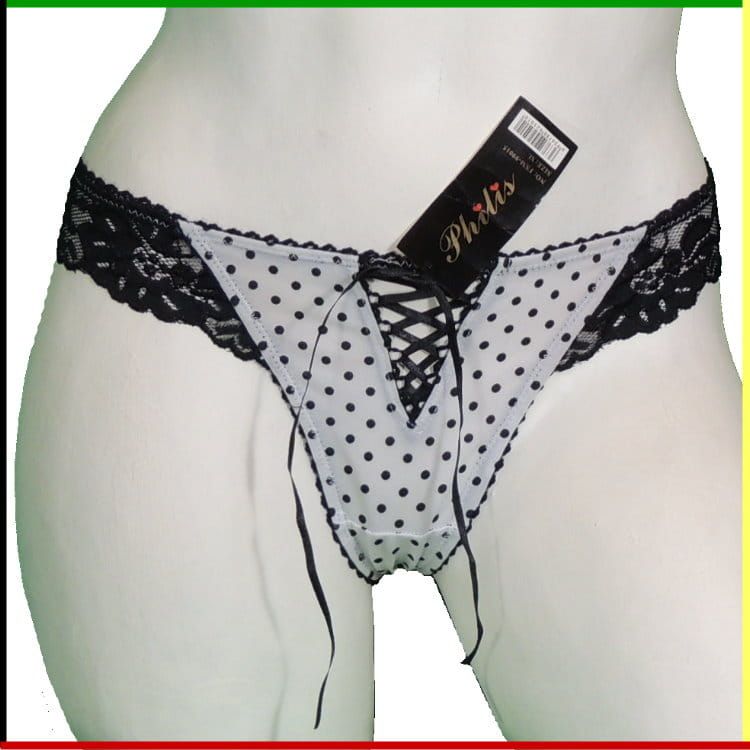 Mannequin met lingerie, voor- en achterkant. Witte slip met stippen, zwarte kant en strikdetails.