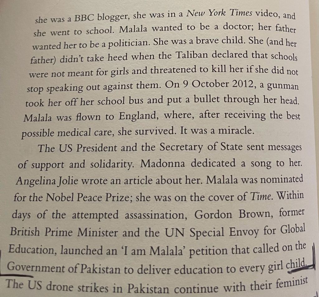 A book is open to a page about malala