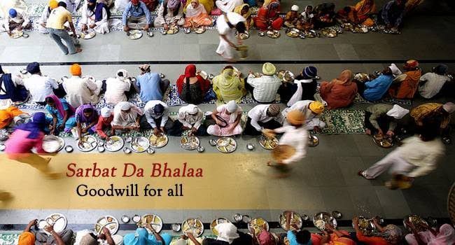 A group of people are sitting in a row with a sign that says sarbat da bhalaa goodwill for all